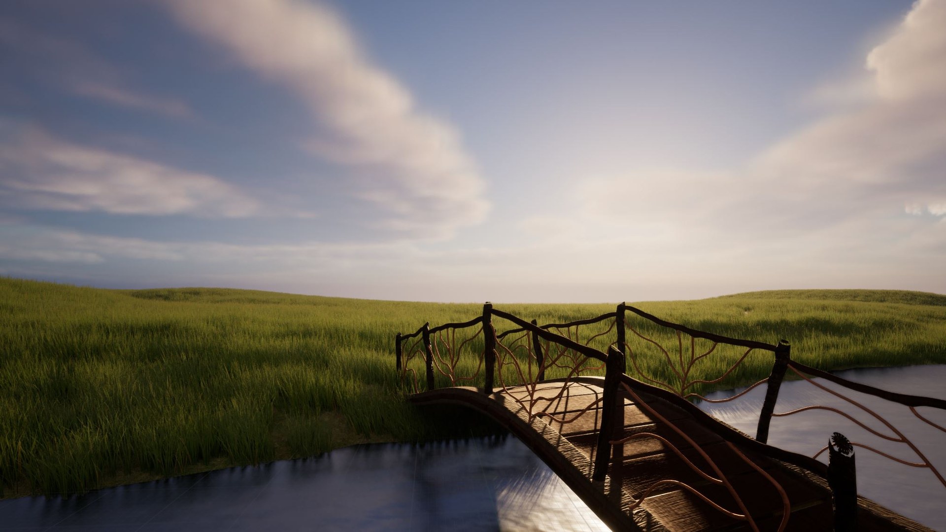 Wooden arched bridge over still water, grassland under a late-day sky.